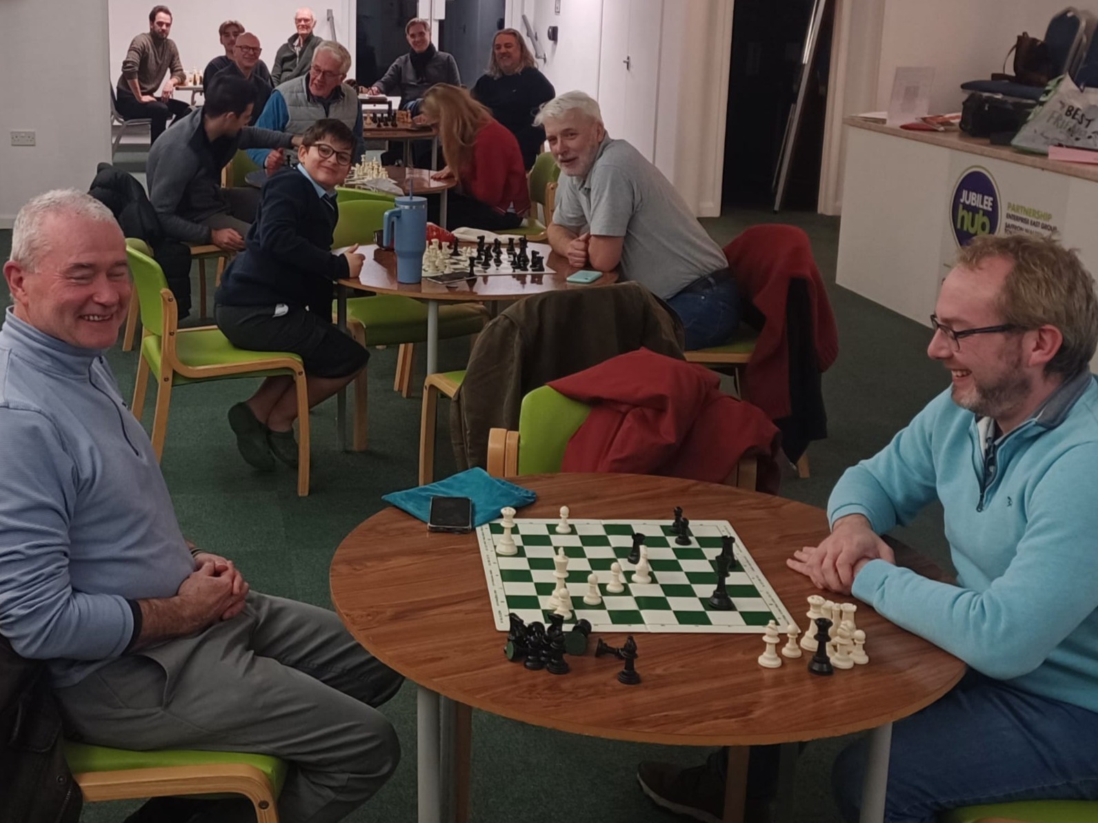 Adults and juniors playing chess together at a Saffron Walden Chess Club evening